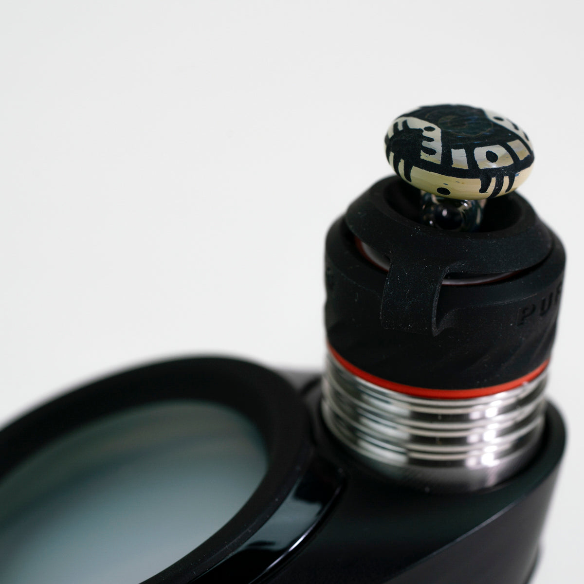 closeup of corkis portal engraved joystick on white background