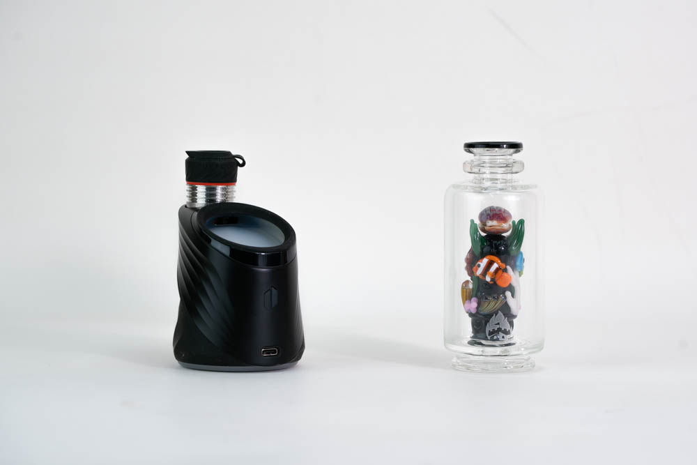 Black Puffco Peak Pro device with fish glass attachment
