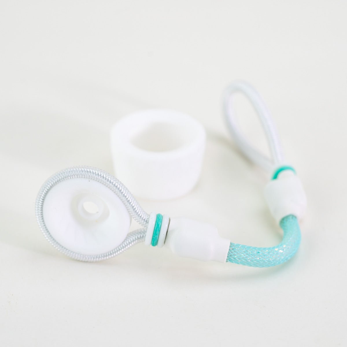 White and turquoise tuff tether attachment on white background