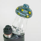 Glass smoking device with colorful top and black base on a white background