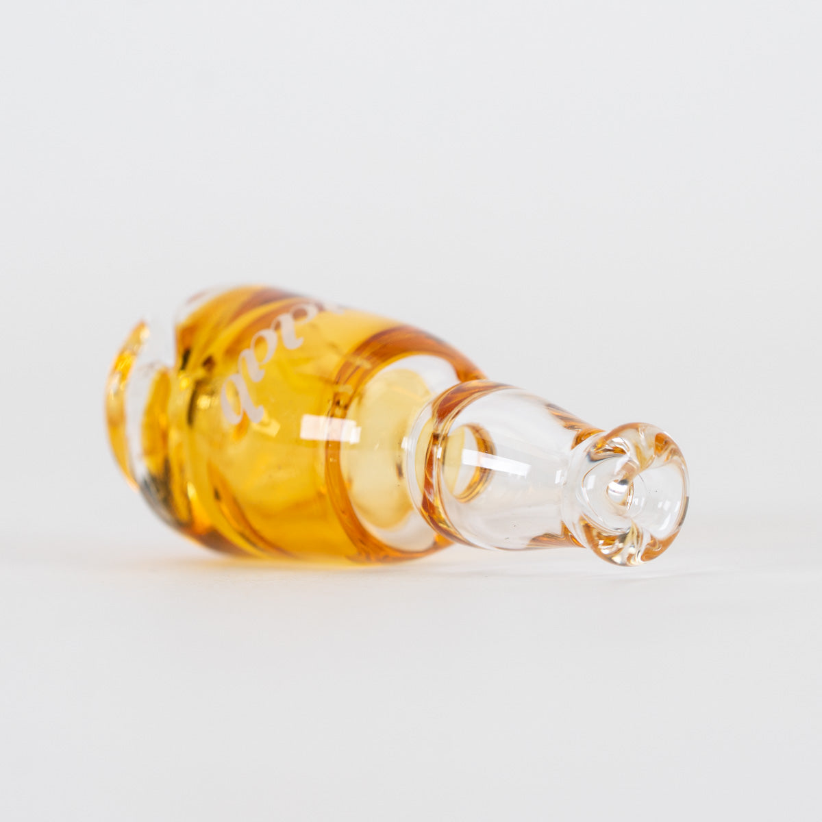 Amber glass Puffco Pivot mouthpiece with white iDab logo and sculpted base