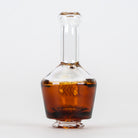Amber Puffco Pivot mouthpiece with clear neck and collectible glass artwork