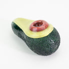 A glass shaped avocado dry pipe with open pit