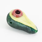 A glass dry pipe shaped like avocado