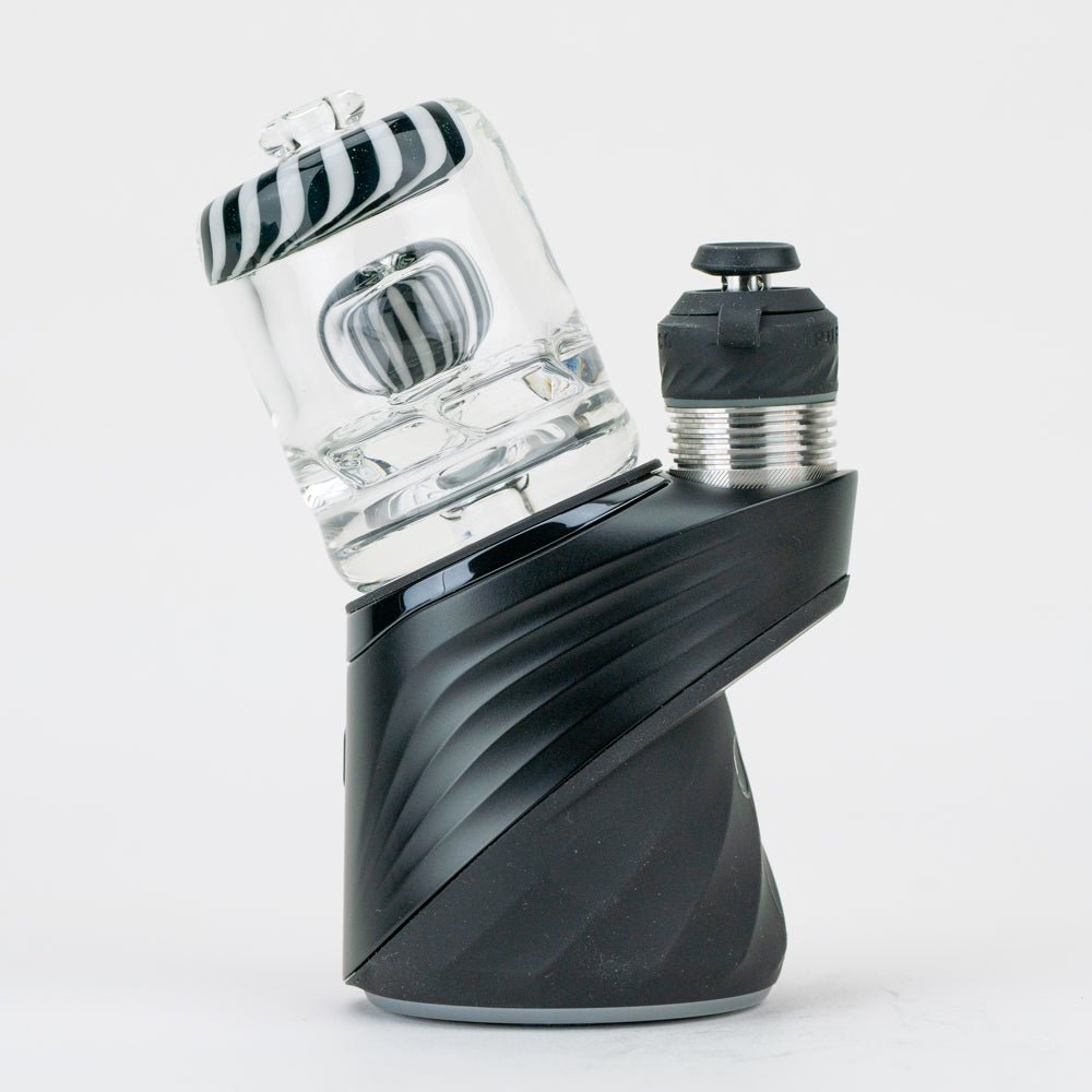 Black and white Puffco Peak dry top attachment by Empire Glassworks on a Puffco Peak Pro