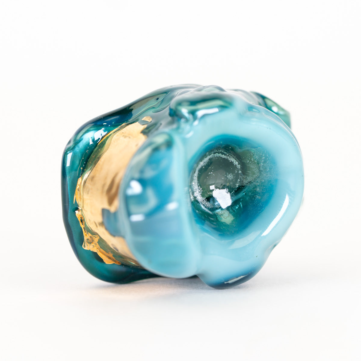 Blue glass pendant shaped like a Spartan helmet