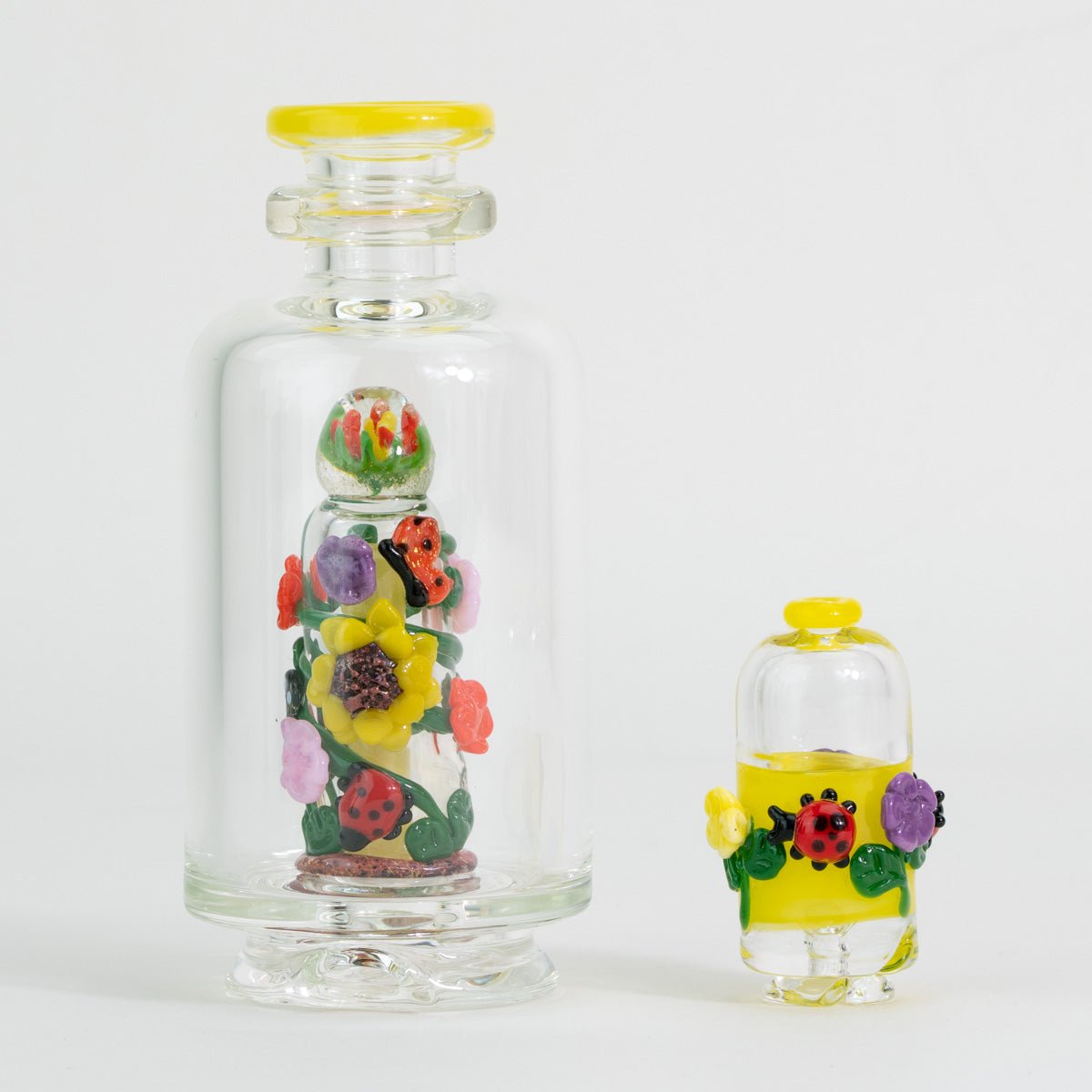 Bright Bloom Puffco Peak glass attachment and Pivot mouthpiece shown with original packaging