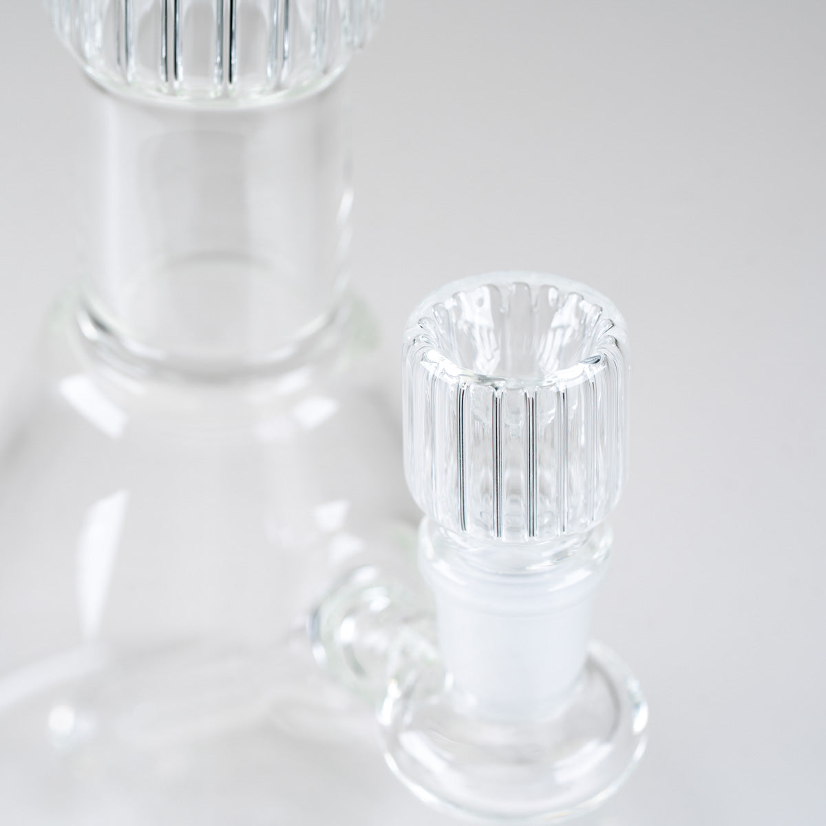 Close-up of the matching ribbed glass bowl and joint on the Empire Glassworks Classics Crystal Beaker