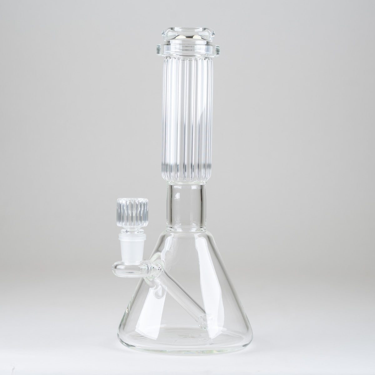 Side view of the Empire Glassworks Crystal Beaker Bong showcasing its integrated downstem and sculpted glass bowl