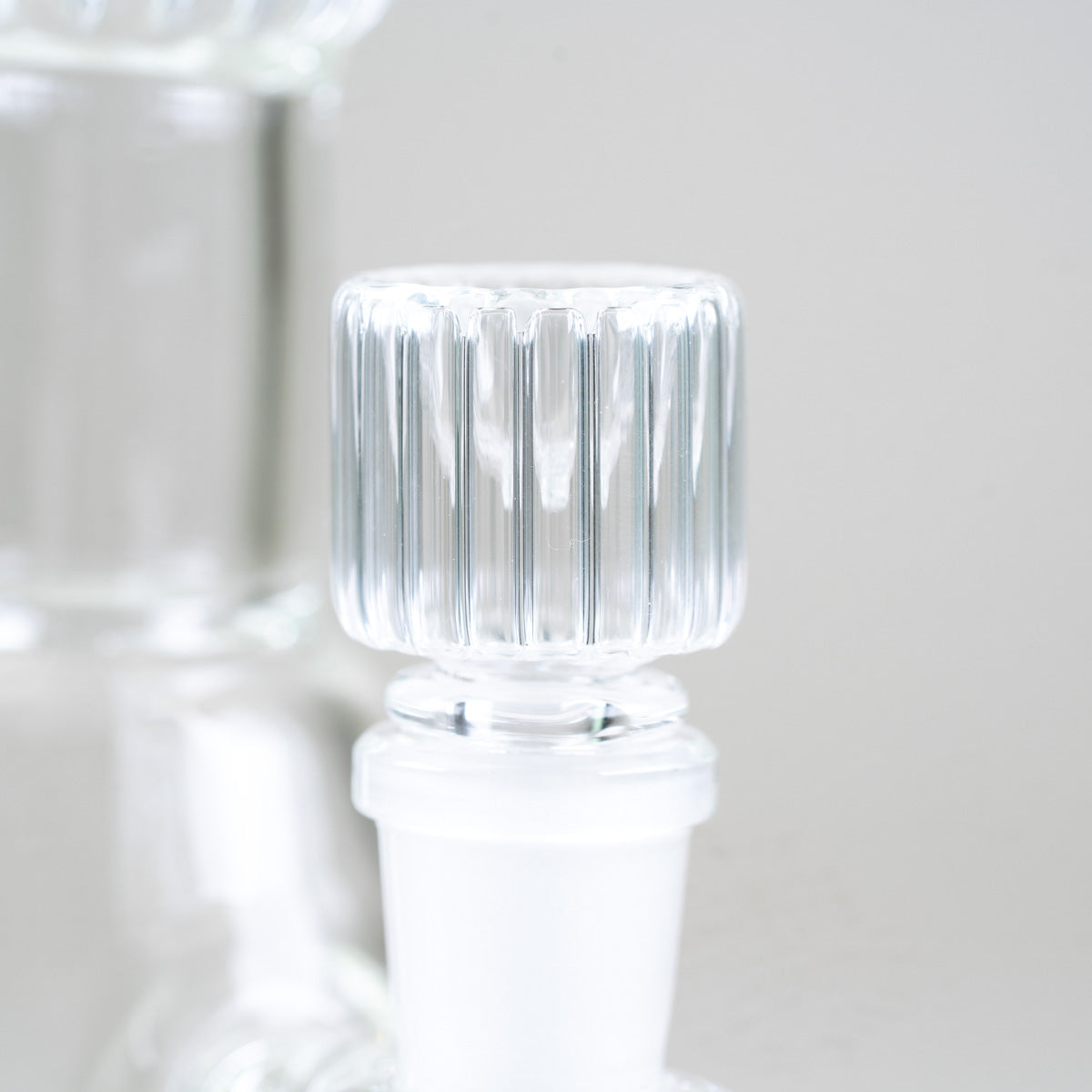 Detailed side view of the clear ribbed glass bowl included with the Empire Glassworks Classics Signature Beaker