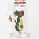 A close up of the glass avocado dab rig with upright mini tube body and side joint