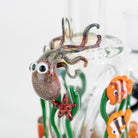 Glass octopus on mini tube with fish and seaweed