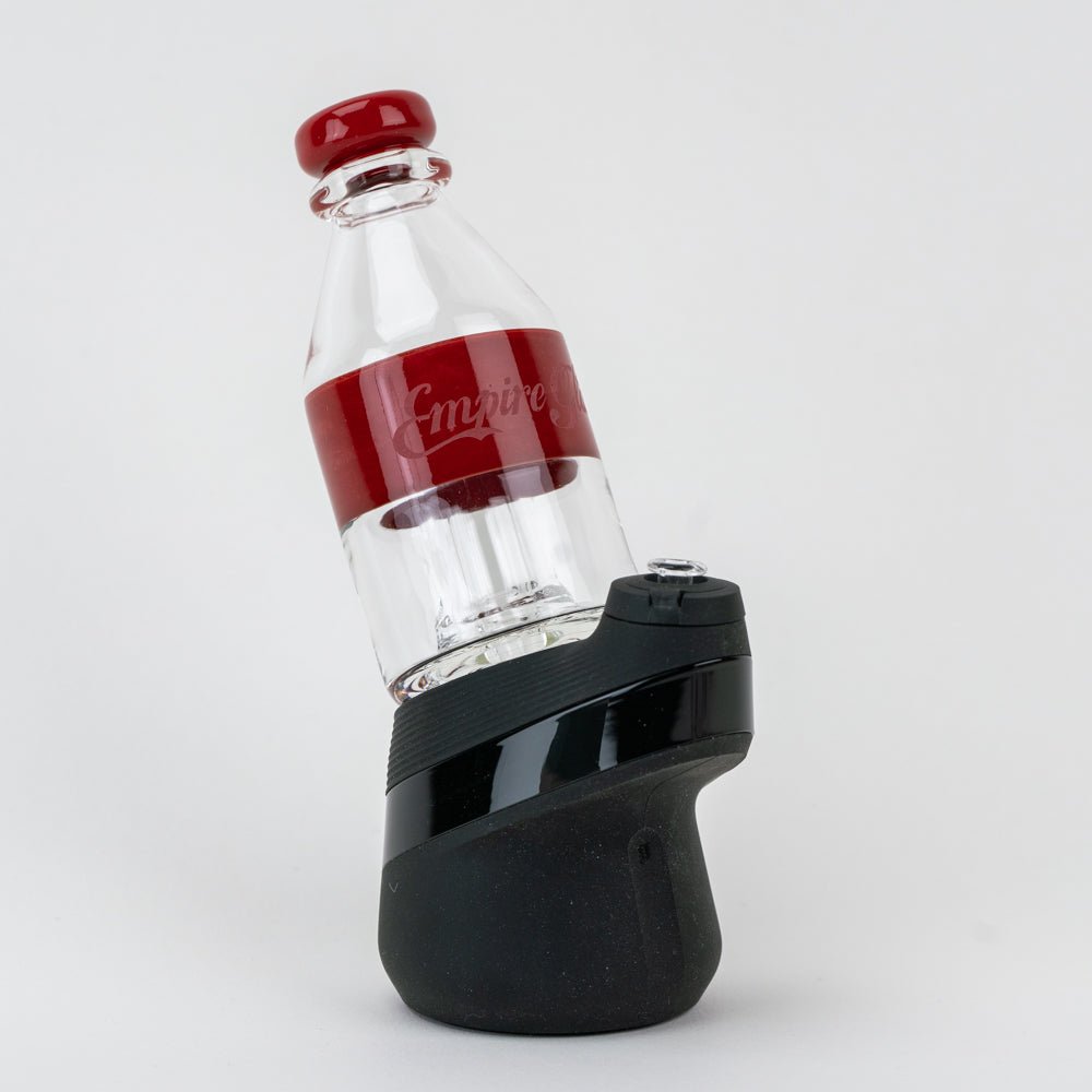 Cola soda pop Puffco glass attachment with a clear bottle-inspired design and red accents