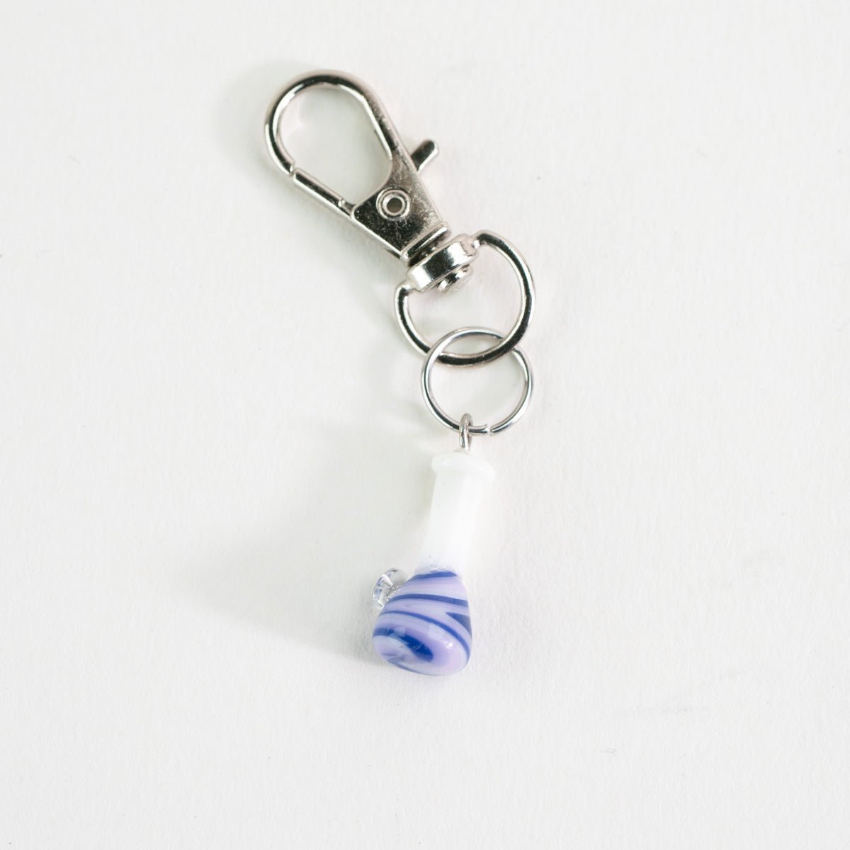 Cute purple beaker bong glass charm styled as a Puffco accessory