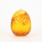 Dragon egg glass dab rig with amber purple color and scale texture