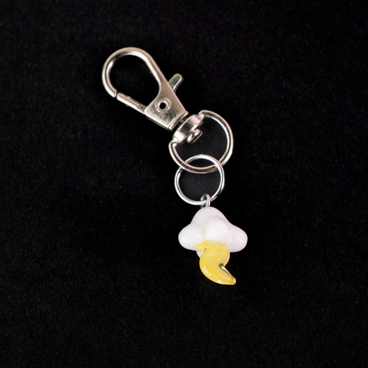Cute lightning glass charm styled as a Puffco accessory