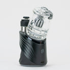 Back view of the black and white Puffco dry top attached to a Peak Pro device