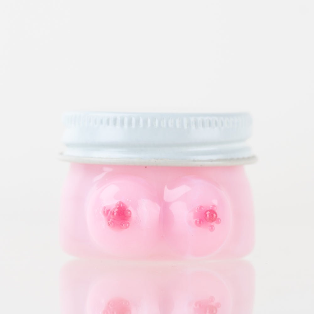 Empire Glassworks Boobies Terp Jar with pink glass body and sculpted novelty design