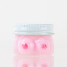 Empire Glassworks Boobies Terp Jar with pink glass body and sculpted novelty design