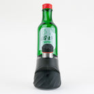 Puffco Peak device fitted with the green Soju Bottle glass attachment filled with water