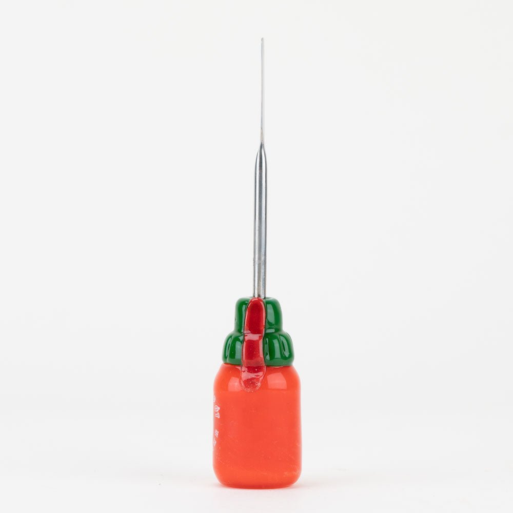 Empire Glassworks hot sauce dab tool with bottle-inspired glass artwork