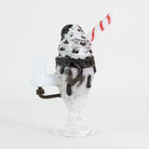 A cookie sundae mini rig turned back on white background