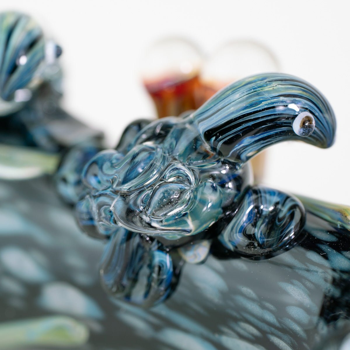 Glass sea turtle figurine on spoon glass pipe
