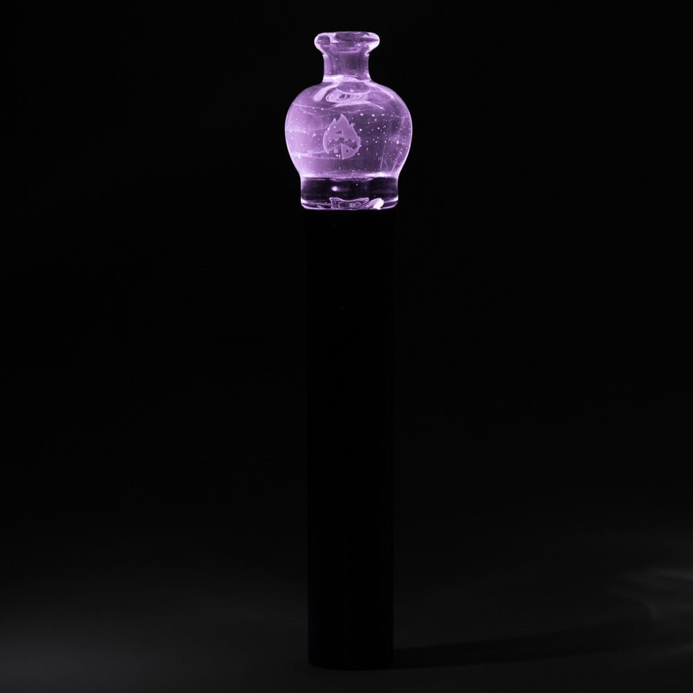 Empire Glassworks UV pink Puffco Pivot glass mouthpiece glowing under UV light