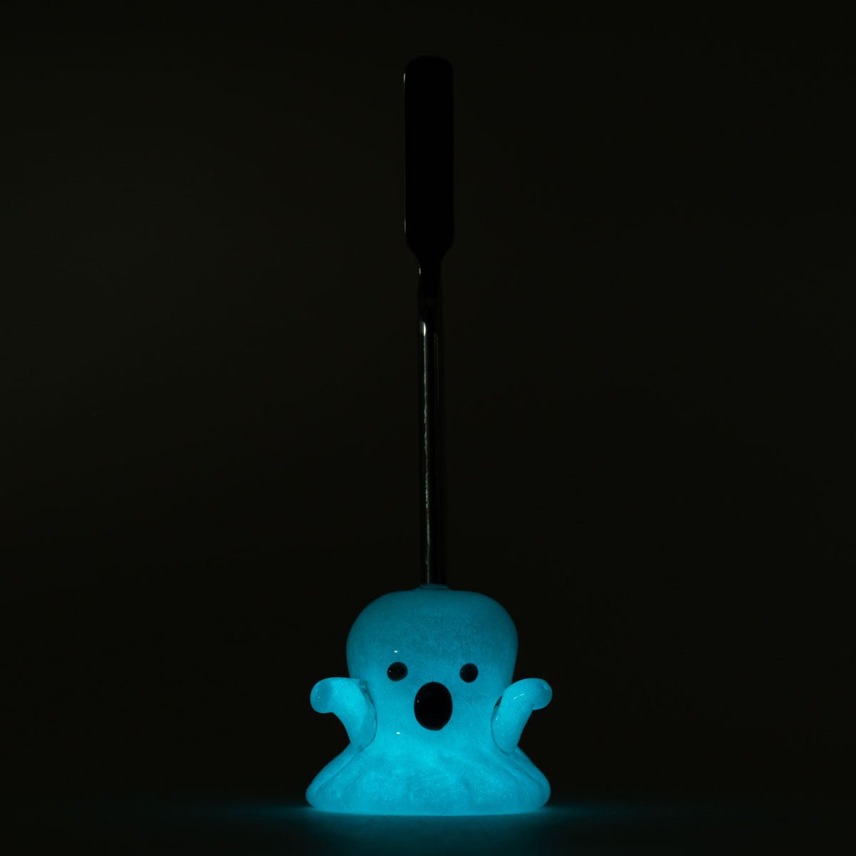 Ghost glass dabber tool with spooky white body, black face details, and metal tip