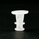 Close-up of a glow in the dark Puffco glass joystick cap