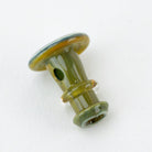Close-up of green Puffco joystick cap with handcrafted glass detail