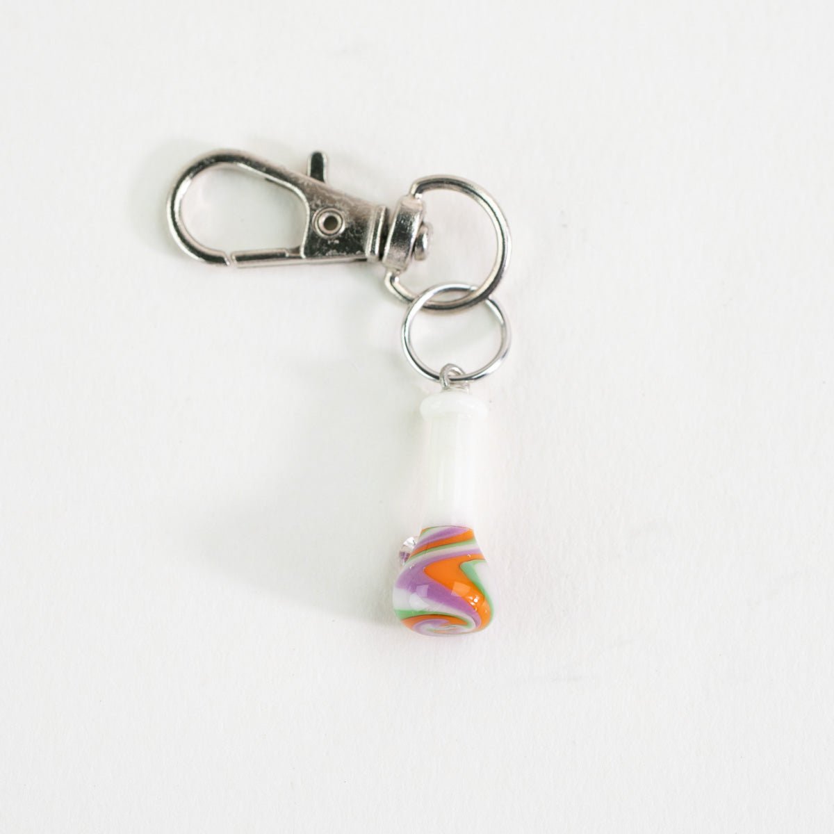 Glass Puffco charm featuring a groovy beaker bong design for setup styling