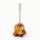 Honeycomb glass dabber tool with amber honey-inspired handle design