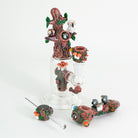 A collection forest themed glass ware including a forest mini rig, bowl piece, spoon pipe, and poker wand
