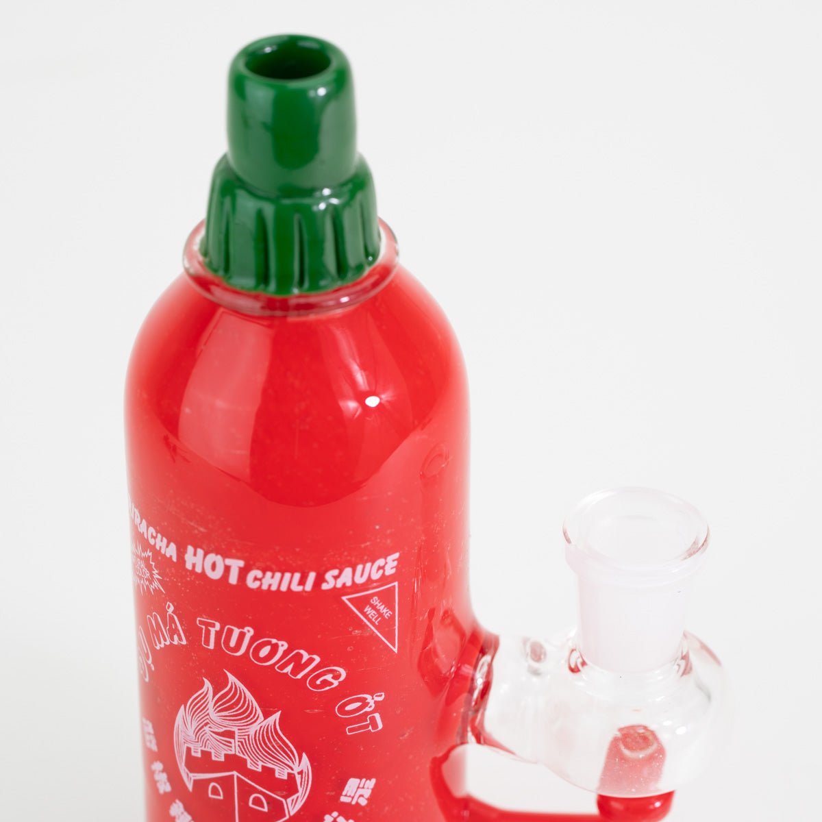 A hot chili red mini rig closeup on white background