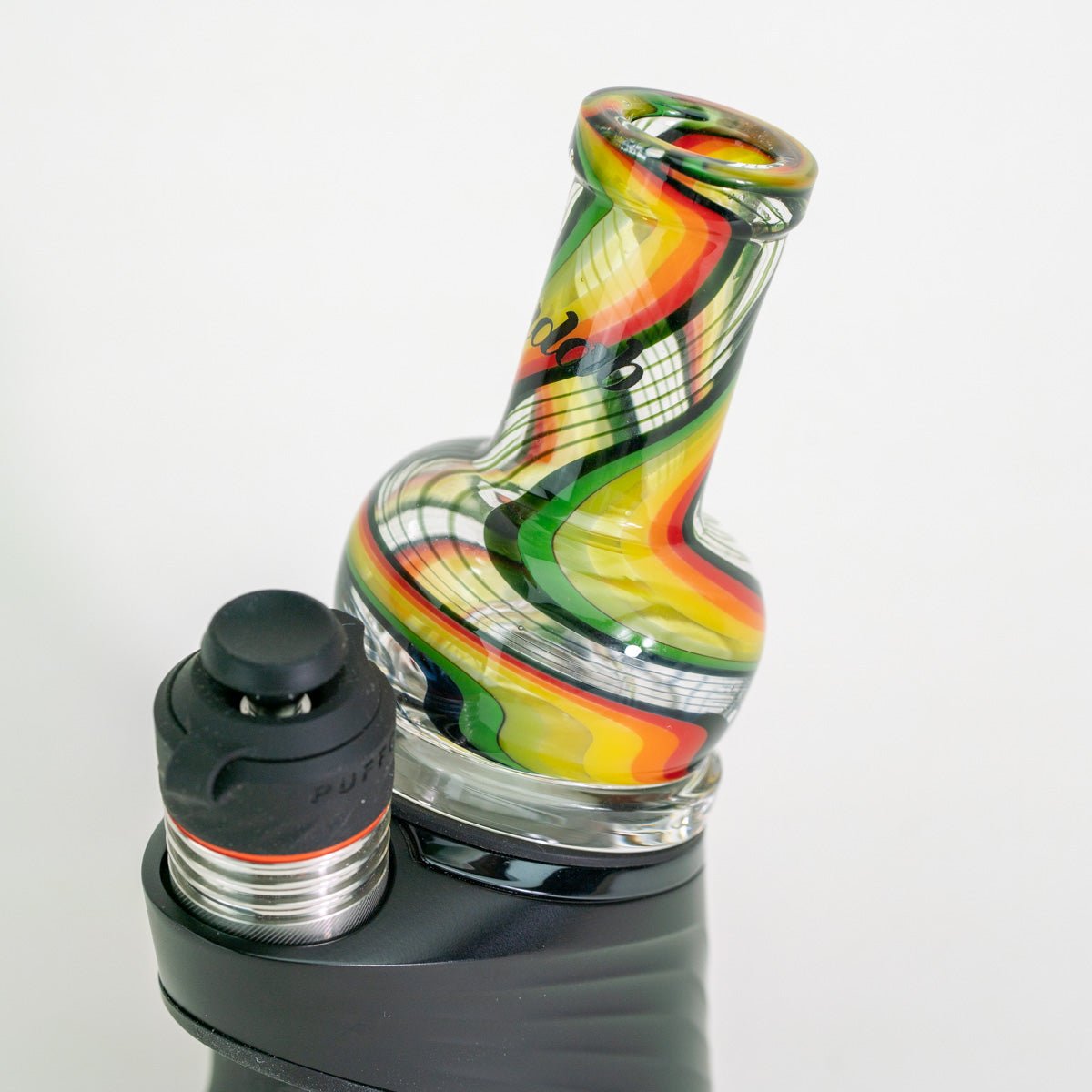 Glass smoking accessory with colorful design on white background