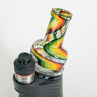 Glass smoking accessory with colorful design on white background