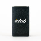 A tall, rectangular black product box with a subtle mandala pattern and the brand name 'idab' in white script on the front, photographed against a clean white background.