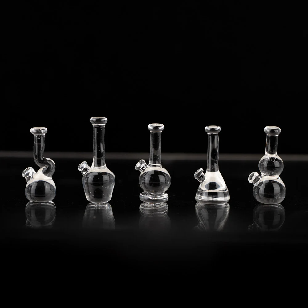 Five piece set of clear, glass lego bongs. Each bong is slightly different shape.