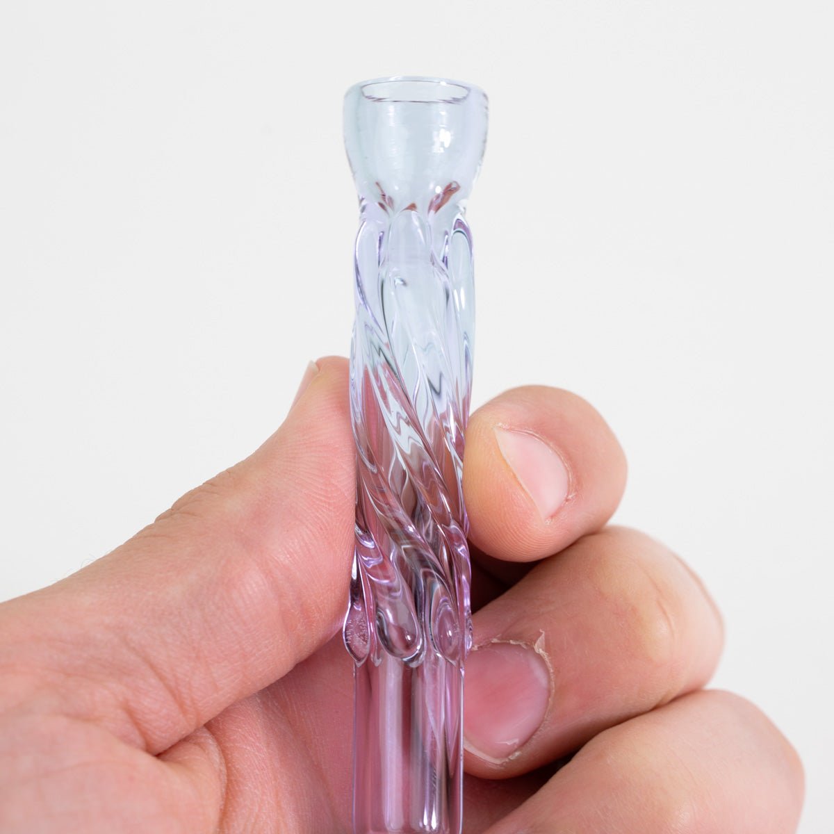 Purple CFL glass pinch hitter chillum held between fingers