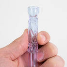 Purple CFL glass pinch hitter chillum held between fingers