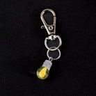 Light bulb glass charm displayed on a Puffco case for everyday carry
creative-glass-puffco-charm-light-bulb