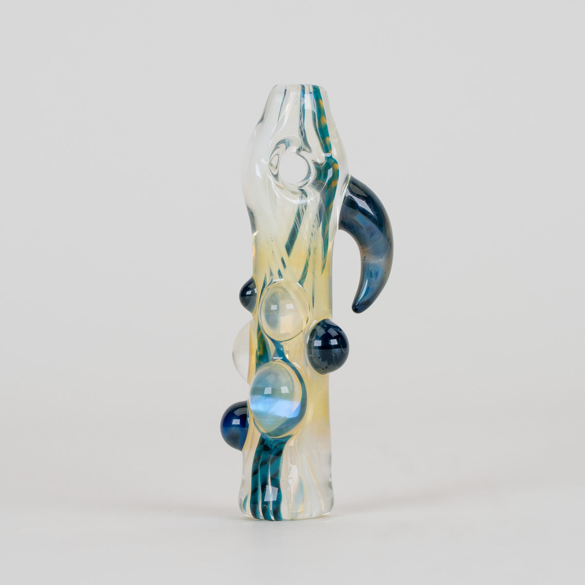 Front view of the Marine Life glass chillum with flowing aquatic color lines