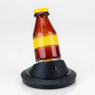 Mexican Pilsner Puffco Peak glass attachment with beer bottle inspired design by Empire Glassworks seated on a Puffco Peak display stand