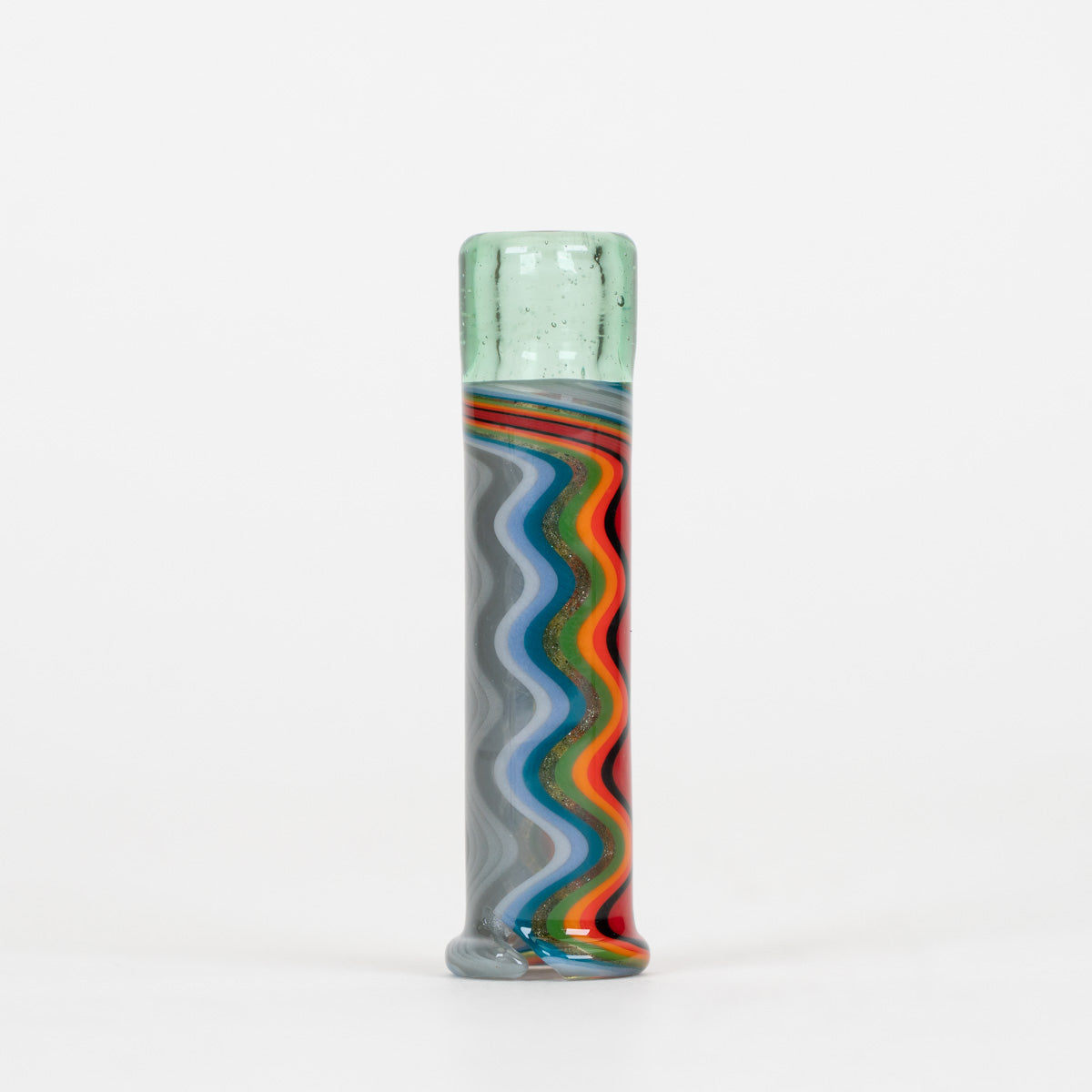 A tall, cylindrical hand-blown glass vase with a light green textured top and a wavy, multicolored striped pattern in gray, blue, orange, red, and green on a white background.