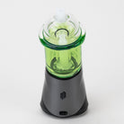 Back view of the Sour Apple Puffco Peak glass attachment on a black Puffco Peak device