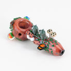 a spoon with owls and nature figurines facing away