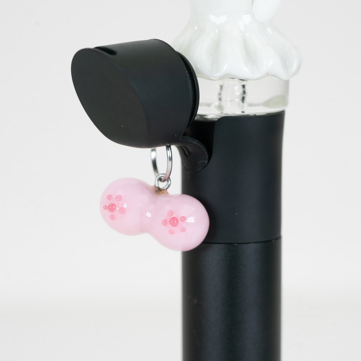 Front view of the pink Boobies glass charm with raised darker pink details