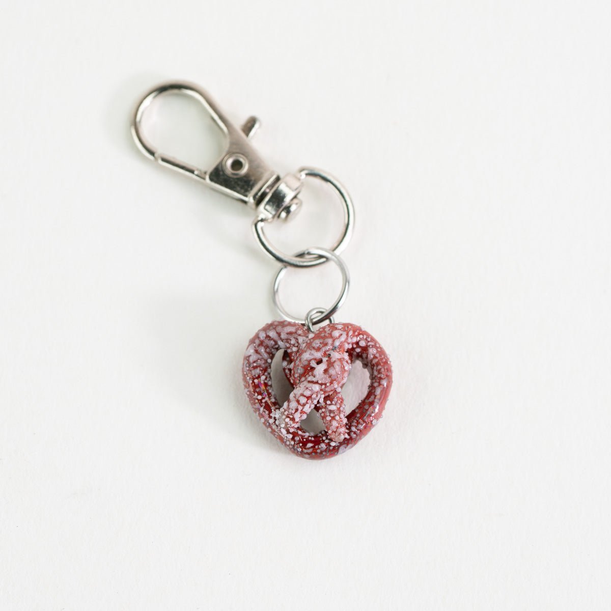 Glass Puffco charm shaped like a pretzel for a fun setup accent