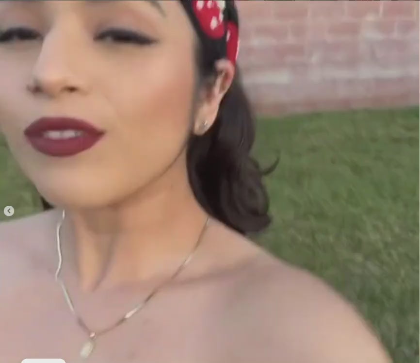 A female influencer showing off some of Empire Smokes most popular glass and accessories